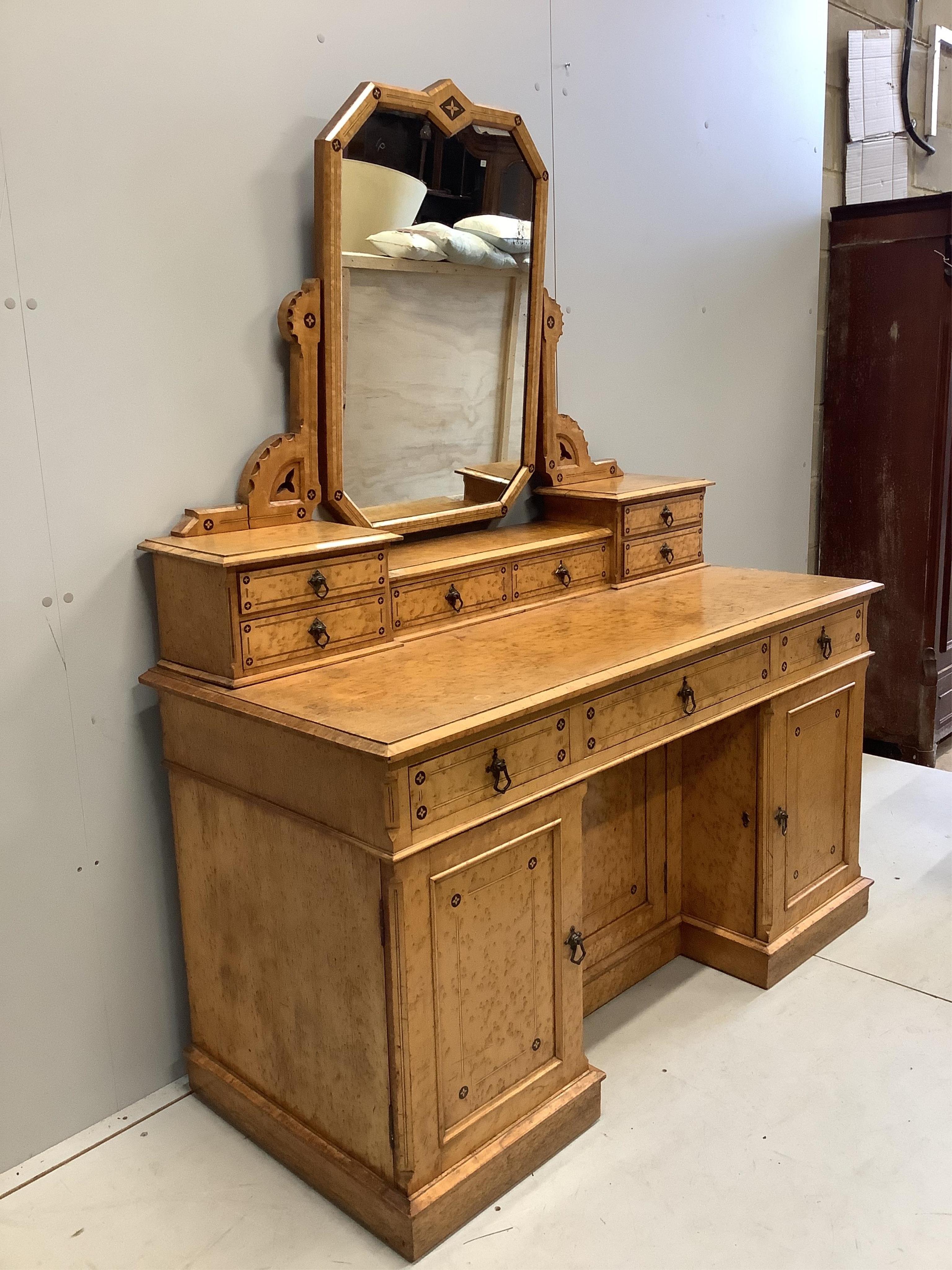 A late Victorian Gothic revival ebony inlaid, bird's eye maple bedroom suite, manner of Charles Bevan, comprising 5ft bed frame, kneehole dressing table, chest of drawers, marble top washstand, bedside cabinet, commode a